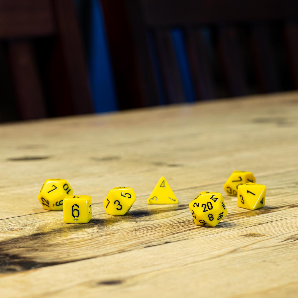 Chessex #25402 - Opaque Yellow / Black Polyhedral (7ct)