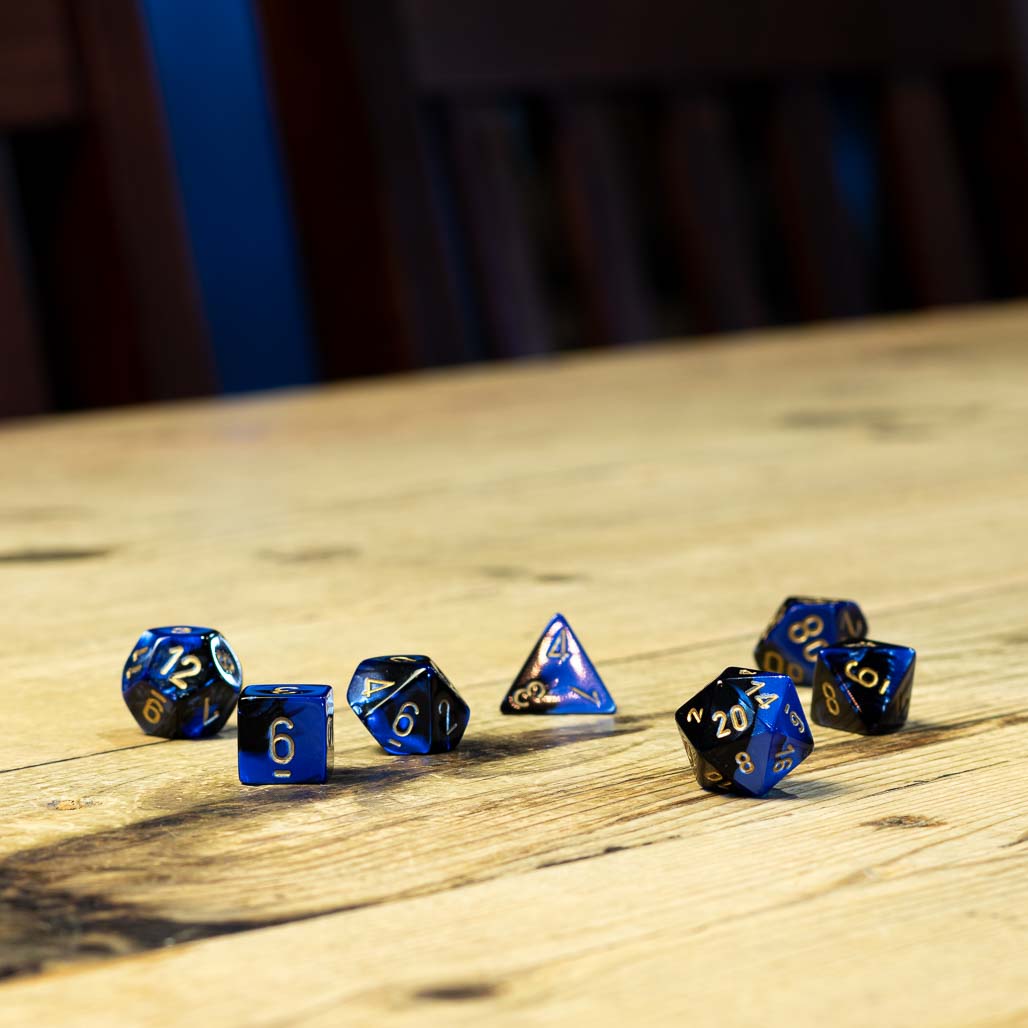 Chessex #26435 - Gemini Black-Blue / Gold Polyhedral (7ct)