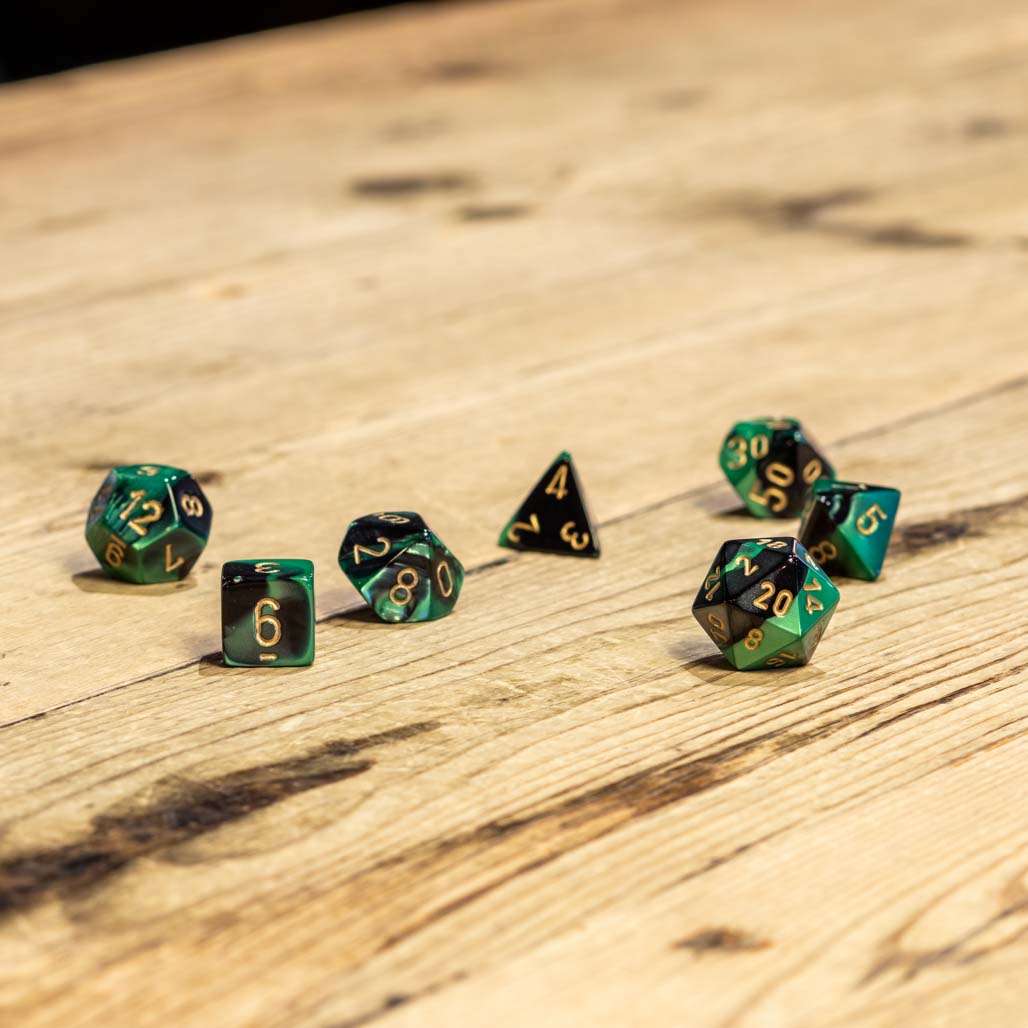 Chessex #26439 - Gemini Black-Green / Gold Polyhedral (7ct)