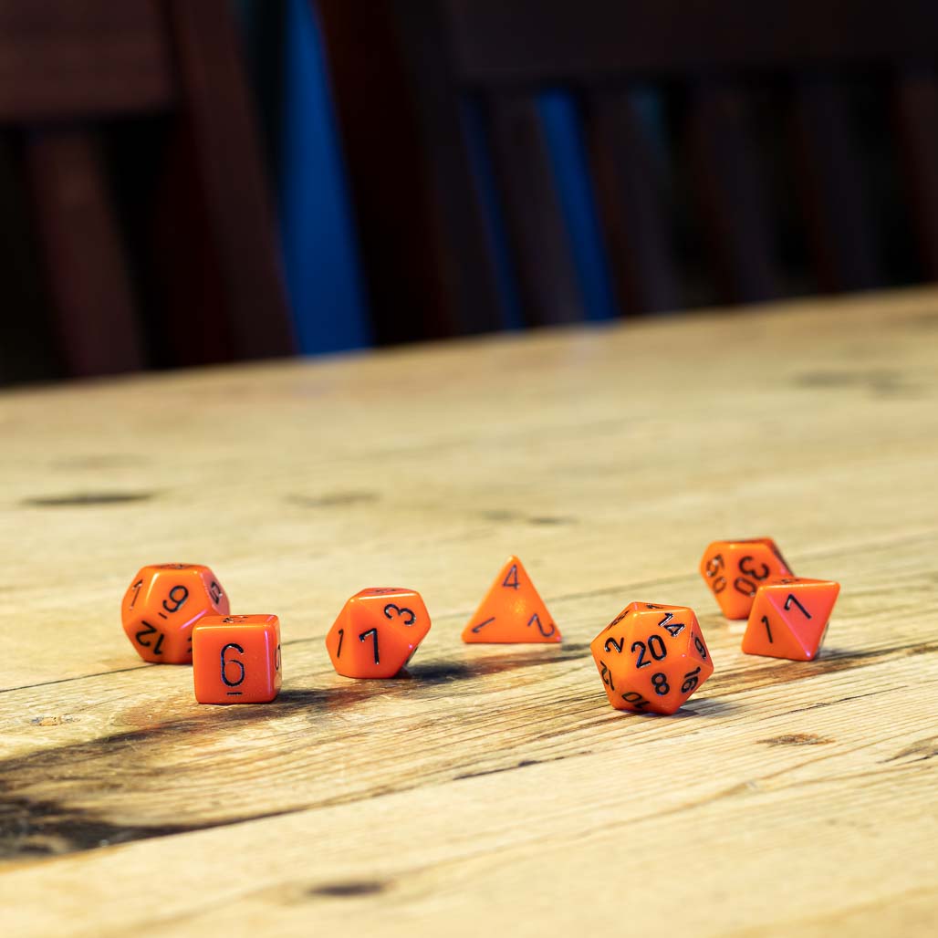 Chessex #25403 - Opaque Orange / Black Polyhedral (7ct)