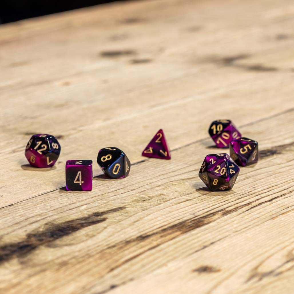 Chessex #26440 - Gemini Black-Purple / Gold Polyhedral (7ct)